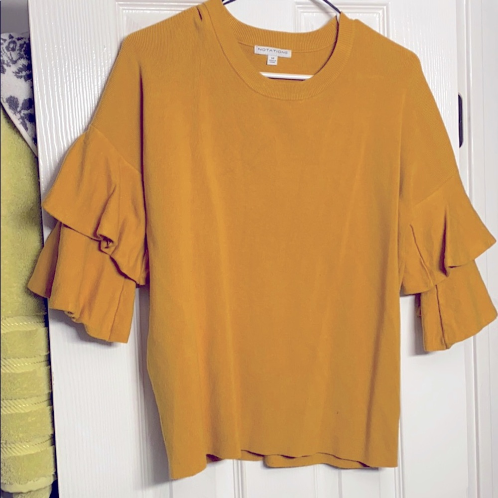 A yellow/cannery colored sweater